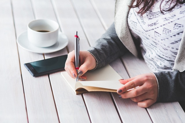 Woman Writing woman writing in a notepad